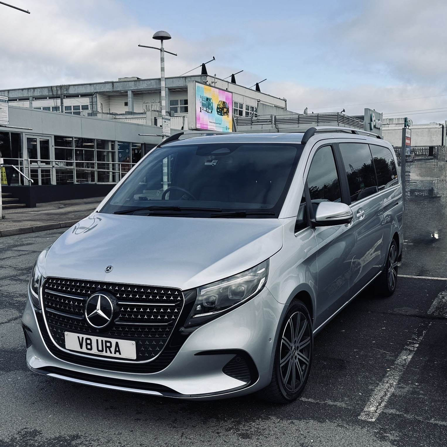 A silver Mercedes-Benz executive people carrier ready for airport transfer