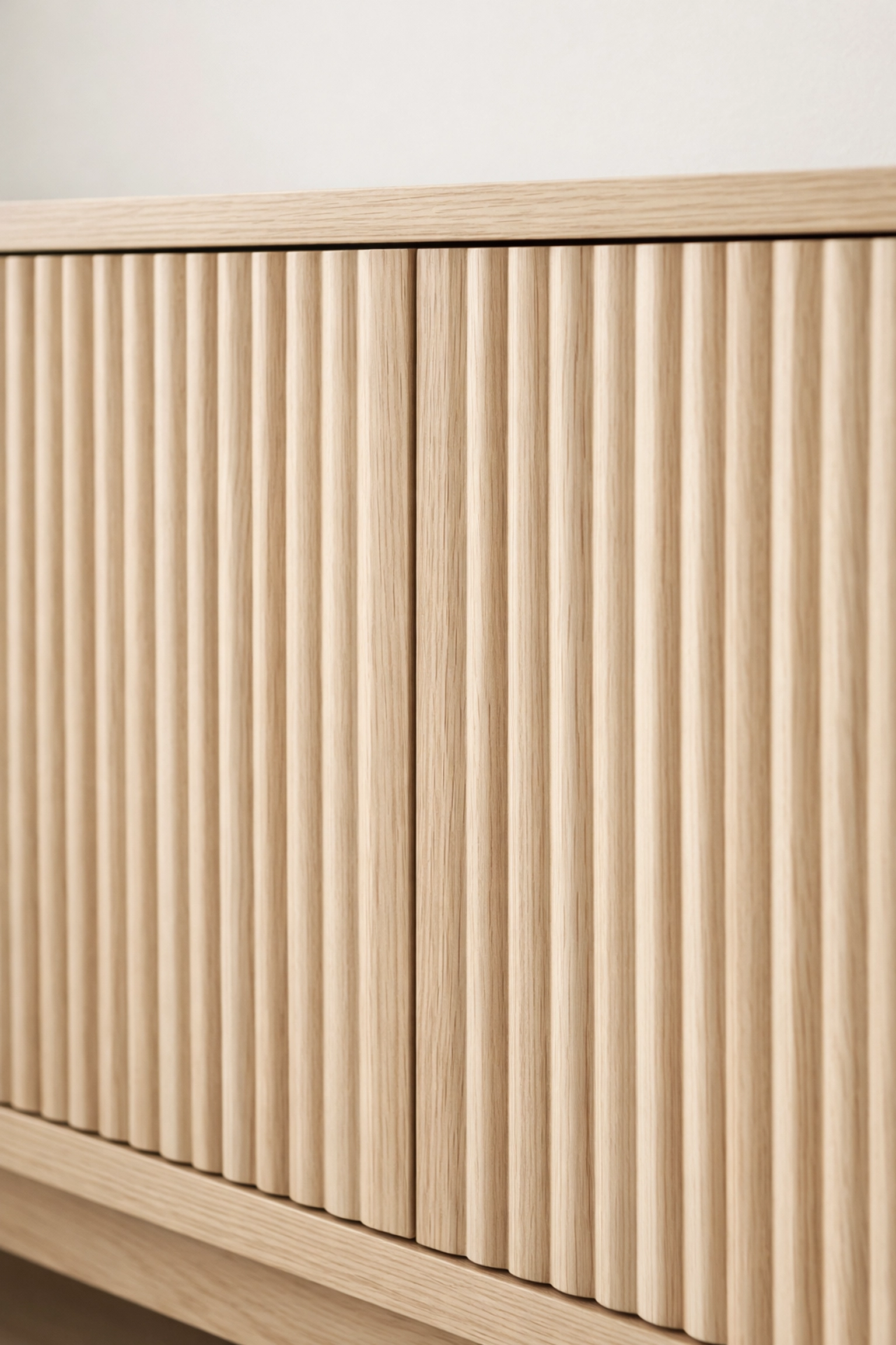 Close-up of fluted wood texture on a luxury TV stand cabinet for a high-end interior design look.