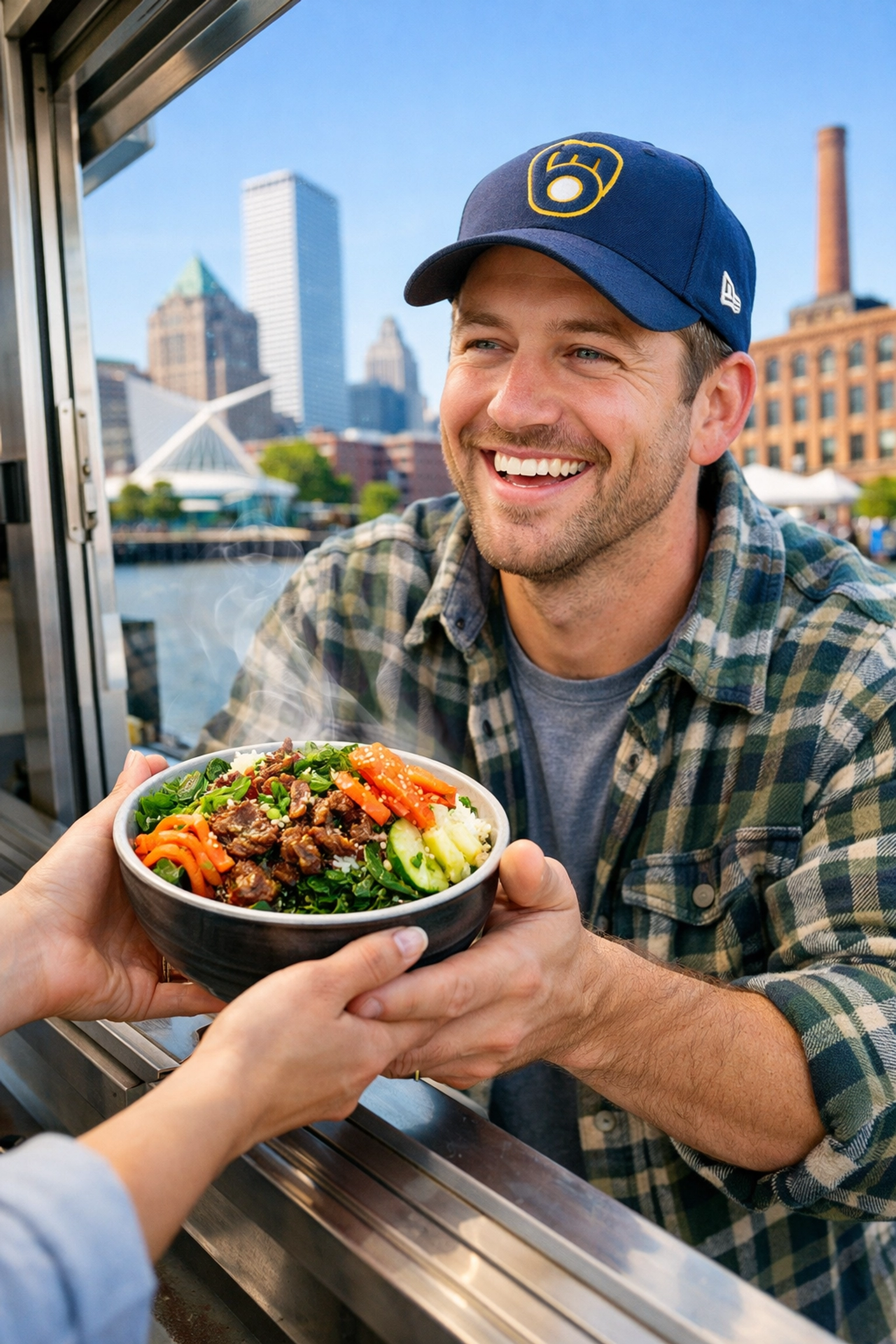 A person smiling while receiving a warm Bulgogi bowl from a food truck in Milwaukee.