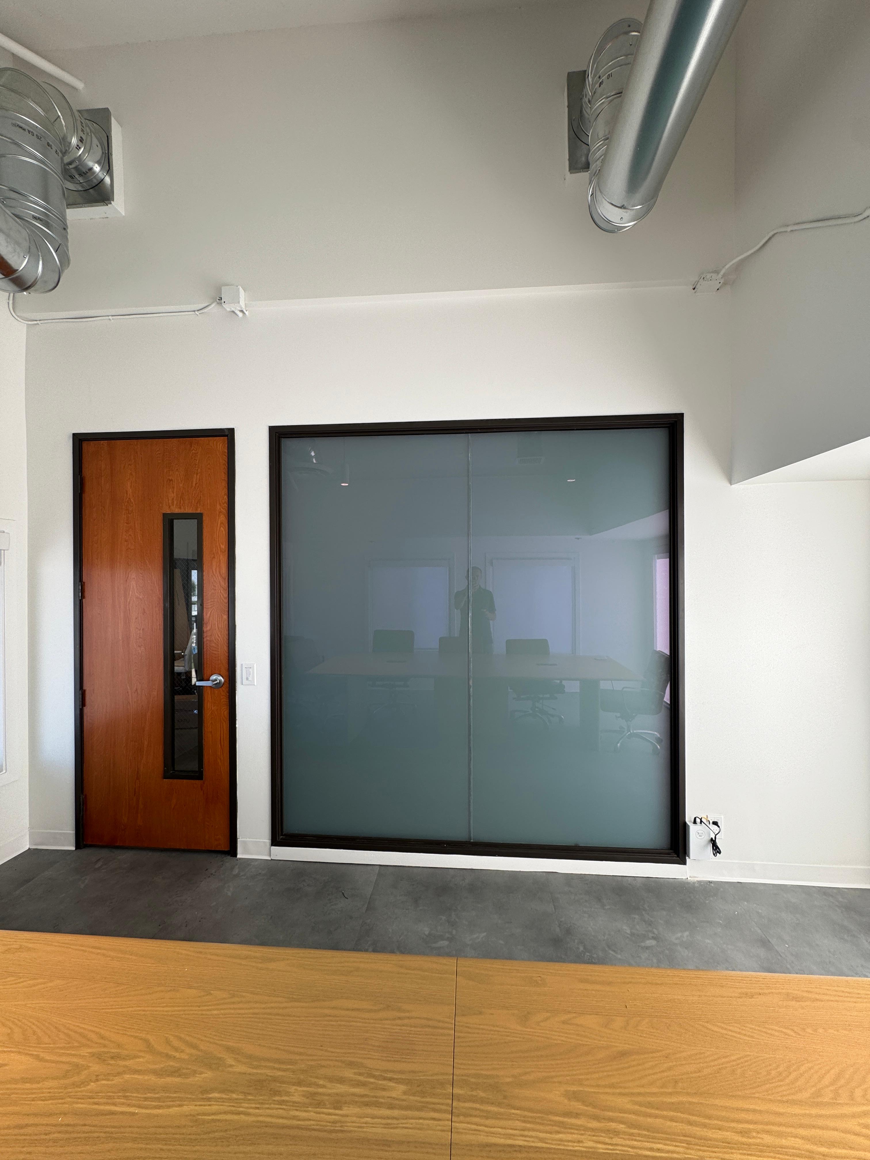 Smart film installed on an interior office conference room window
