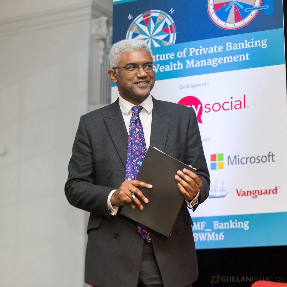 A professional keynote speaker at a wealth management conference illustrating brand integration opportunities.