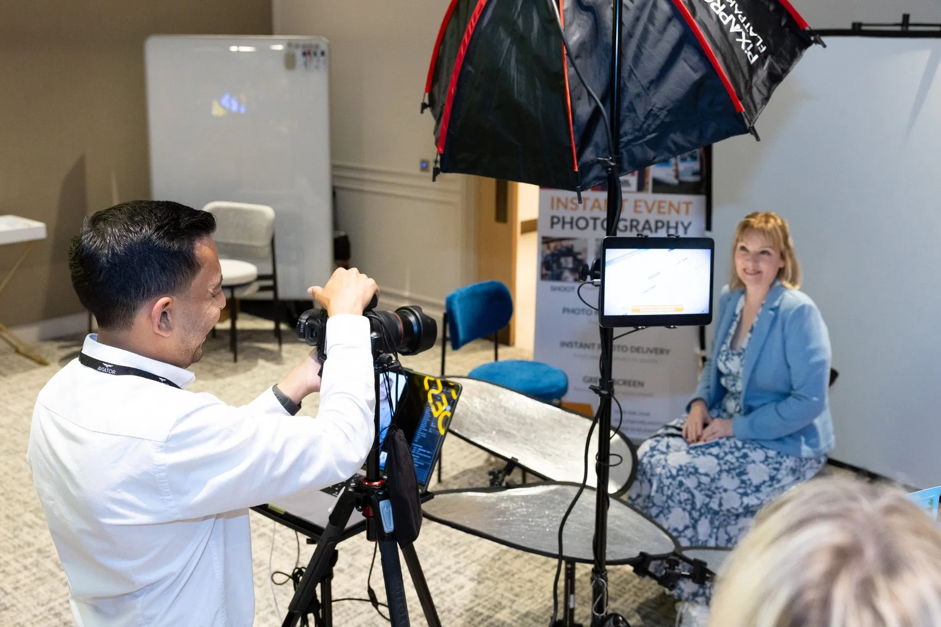 Professional headshot setup at an event demonstrating high-quality on-site image capture and real-time digital content delivery.