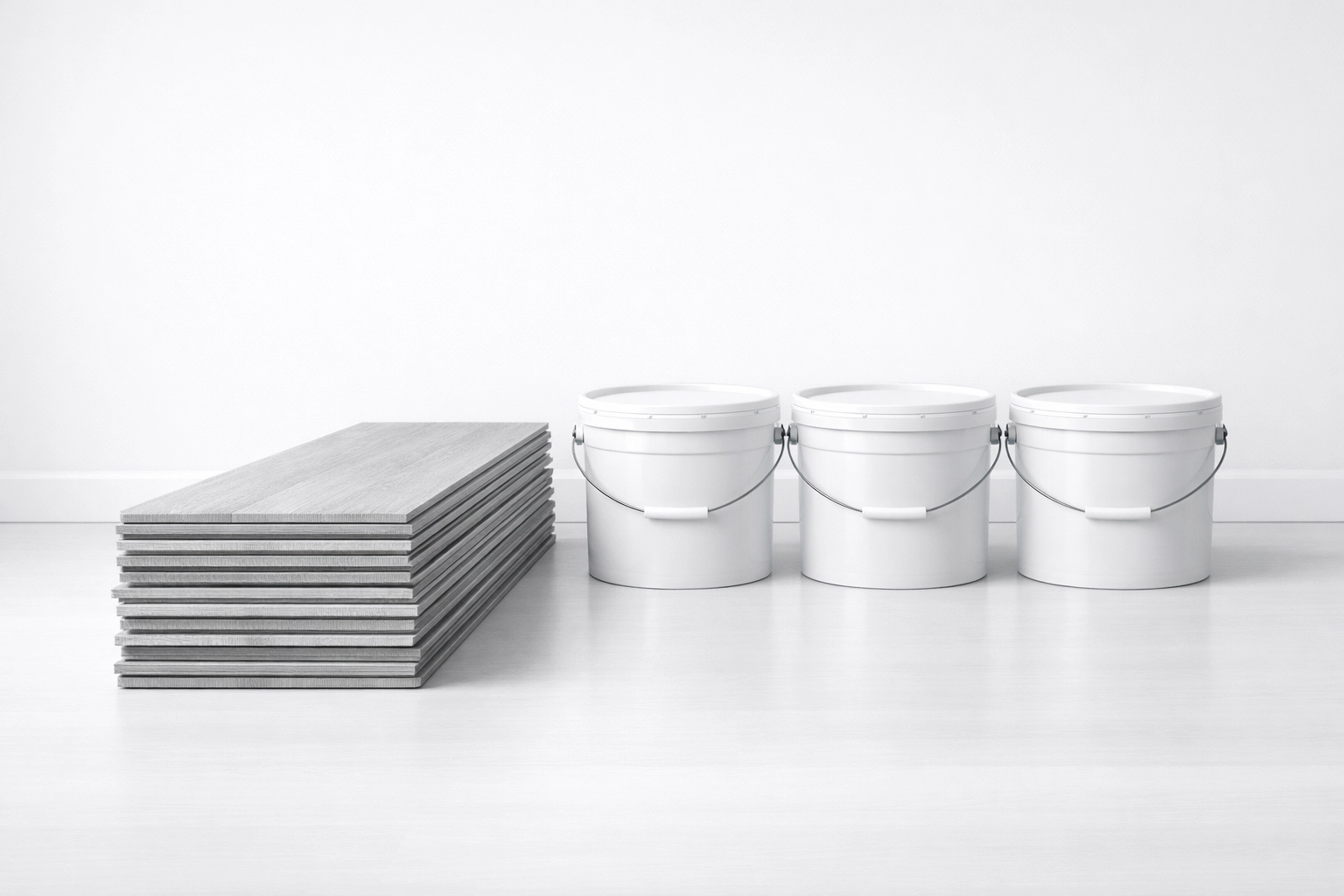 Standardized apartment turnover materials including grey LVP flooring and paint buckets.