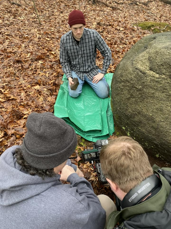 Behind-the-scenes: blocking and camera work for a key moment—actor on the green tarp while we dialed in the frame and performance beat-by-beat