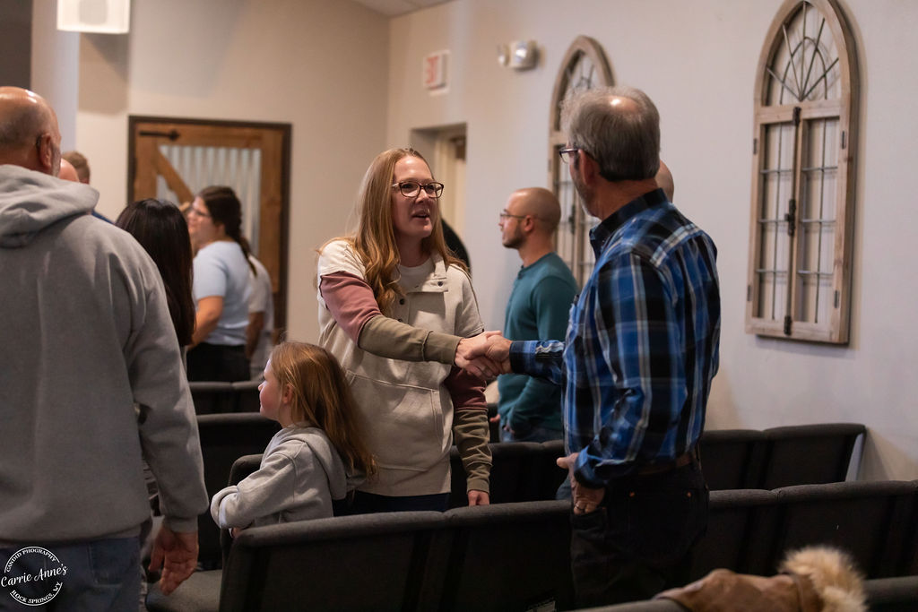 Adults and children greet each other at Green River Alliance Church