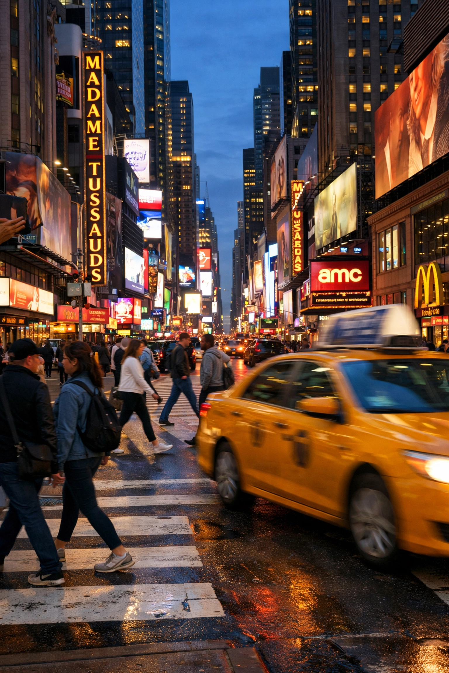 A yellow taxi moves through a neon-lit Times Square at twilight, one of the best places to take pictures in NYC.