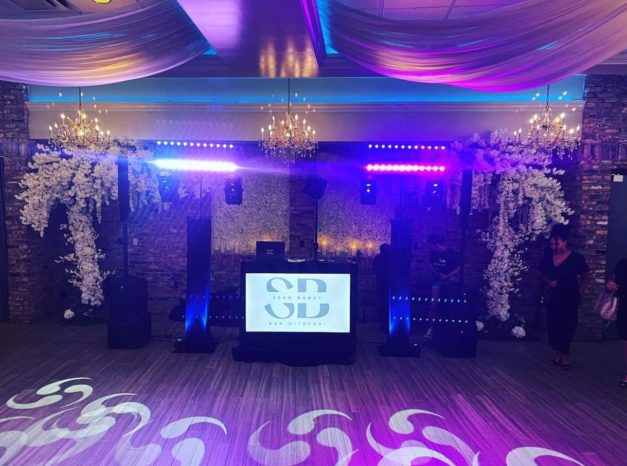 DJ booth setup with custom monogram display