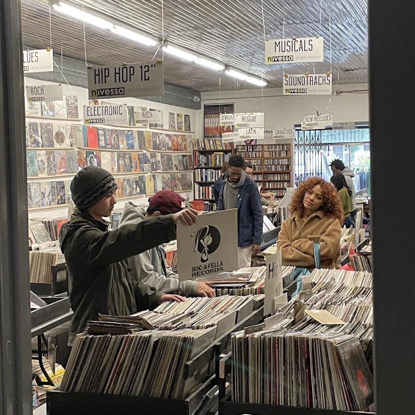 Customers browsing vinyl records at Nivessa