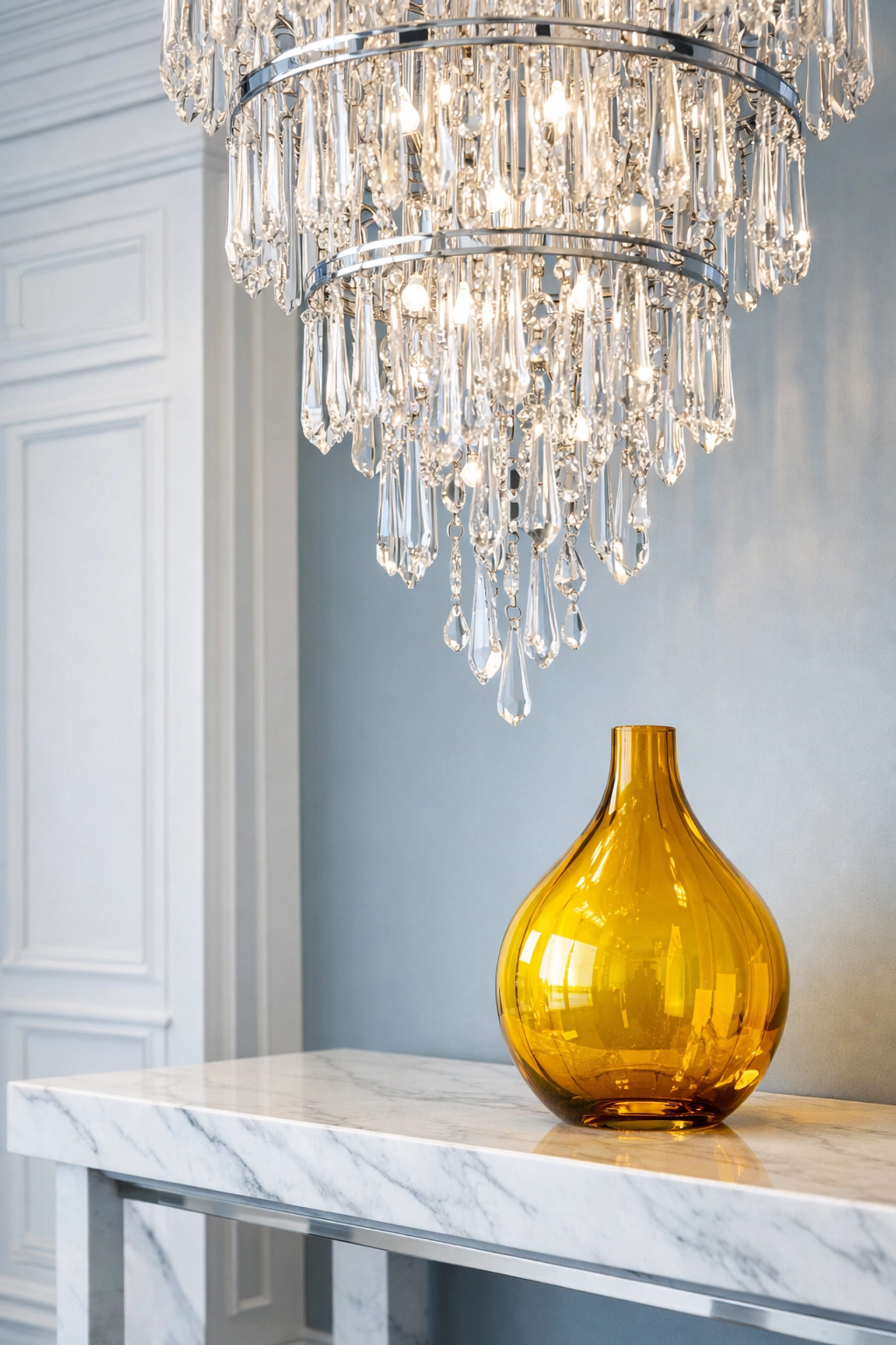Detailed dust-free cleaning of a luxury entryway and chandelier in a premium coastal estate.