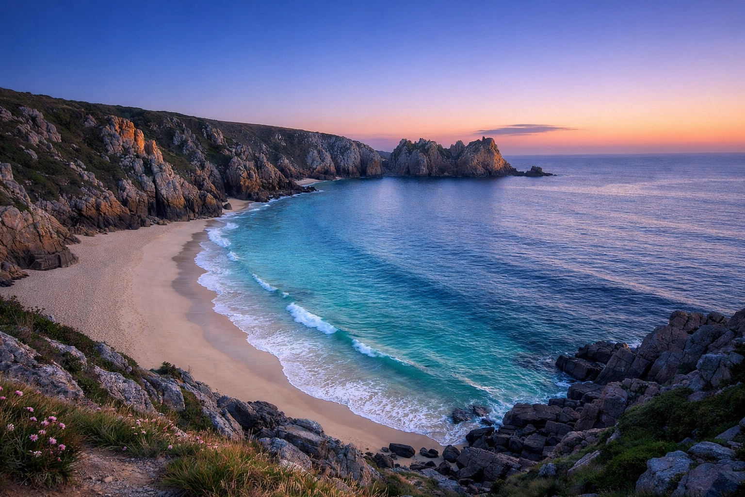 Serene sunrise at Porthcurno Beach, Cornwall, a secluded spot for a peaceful beach ashes scattering ceremony.