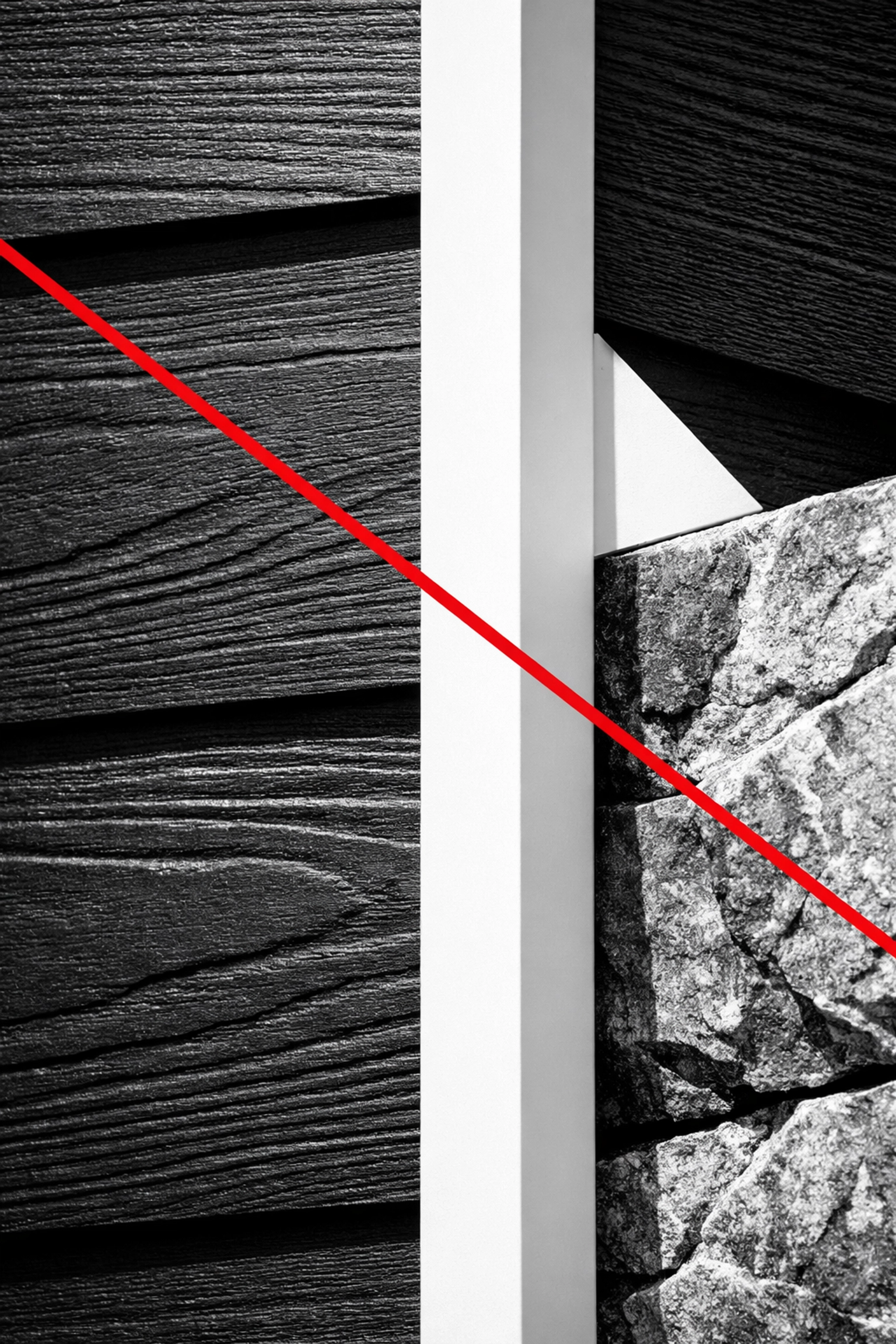 Detailed view of Iron Gray James Hardie siding paired with crisp white trim and stone accents.