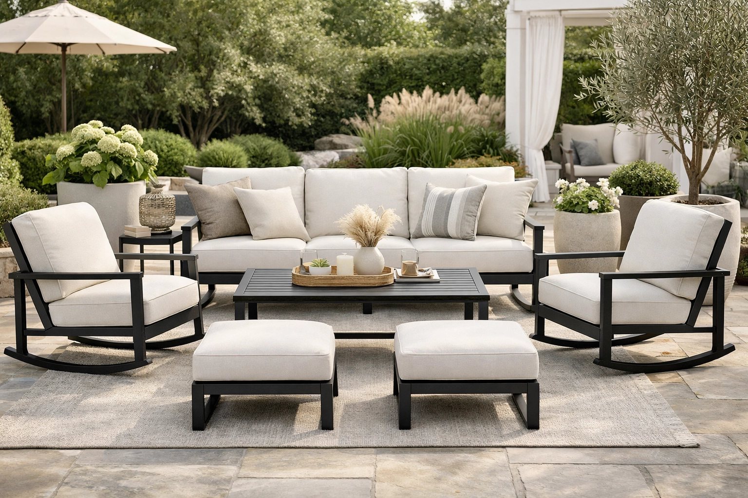 Luxury outdoor patio featuring a modern metal furniture set with thick cushions in a beautifully styled backyard setting.