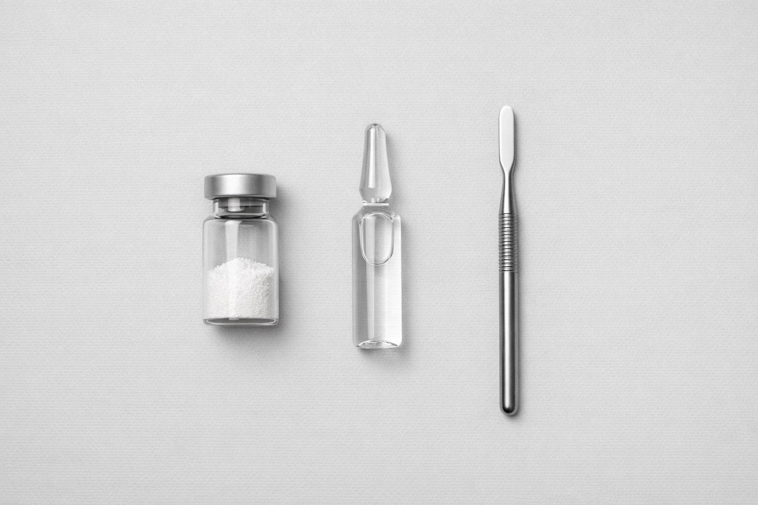 Laboratory essentials for peptide reconstitution including a vial of lyophilized powder and sterile water.