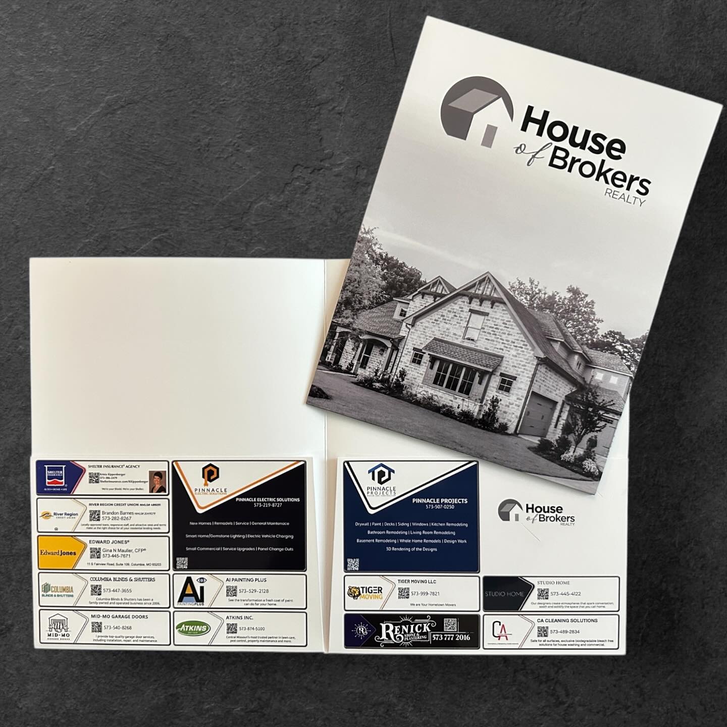 Custom real estate presentation folder for House of Brokers Realty A presentation folder branded for House of Brokers Realty, featuring the brokerage’s design and a property photo on the cover. The folder interior showcases sponsor ads from local service providers, contractors, and lenders, emphasizing Envision Branding’s free, fully managed folder solution tailored for real estate teams.