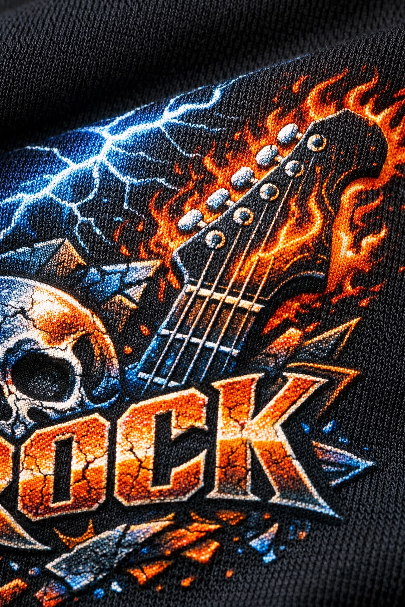 Close-up of high-quality screen print on a premium black cotton official band t-shirt.