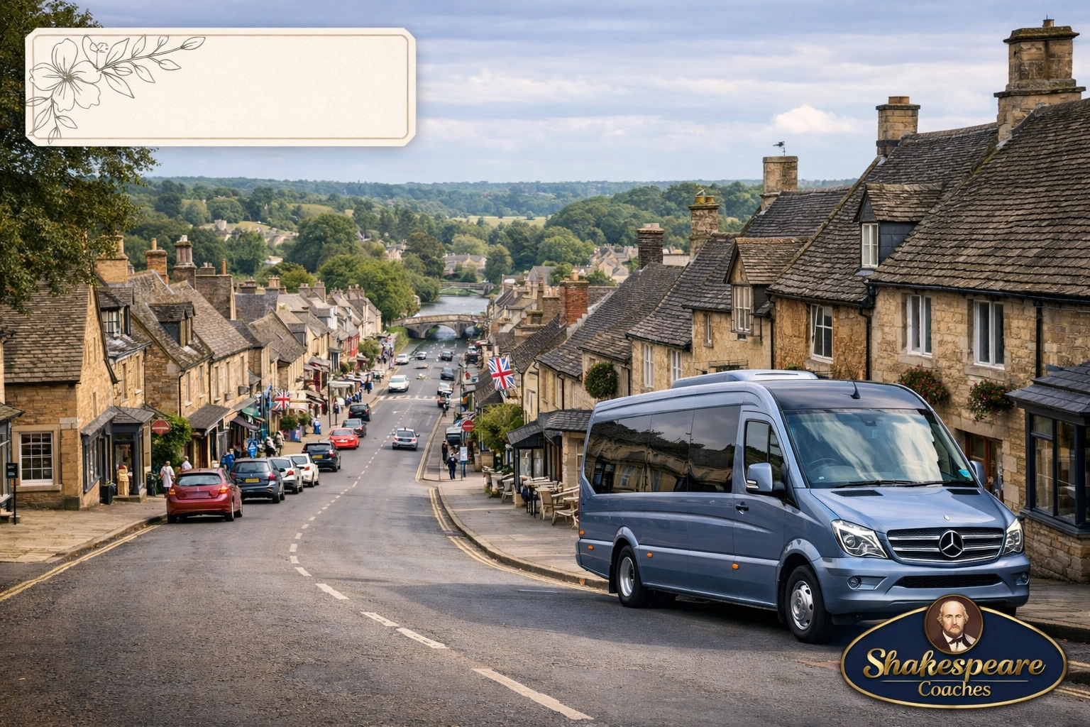 View down the iconic Burford High Street hill featuring historic Cotswold stone architecture and a luxury tour minibus.