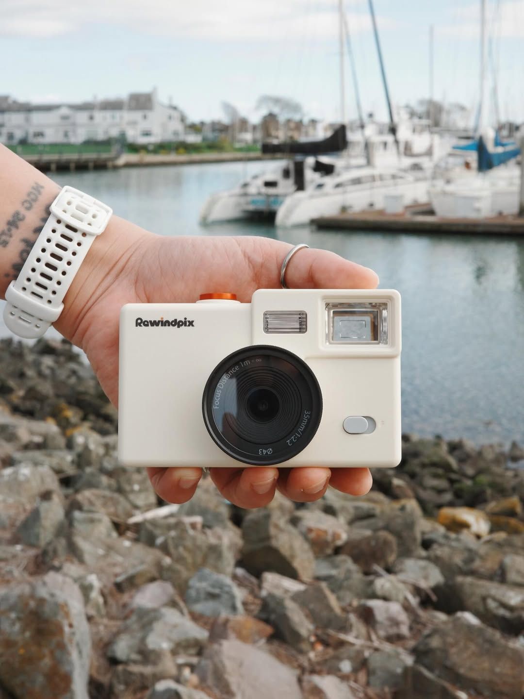 hand-holding-cream-rewindpix-camera-waterfront.jpg