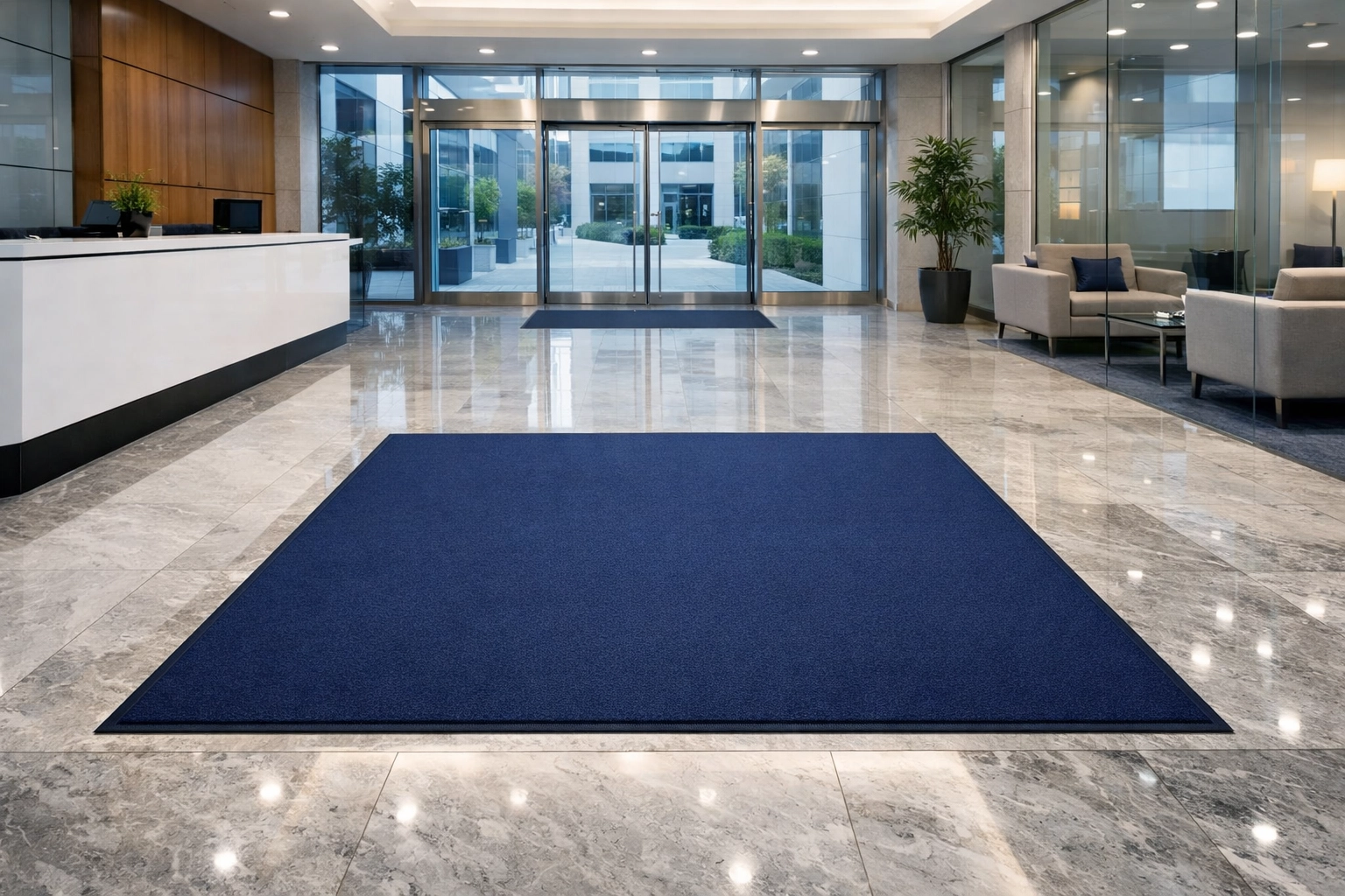 Large-format entrance mat rental providing floorcare in a high-traffic modern office lobby.
