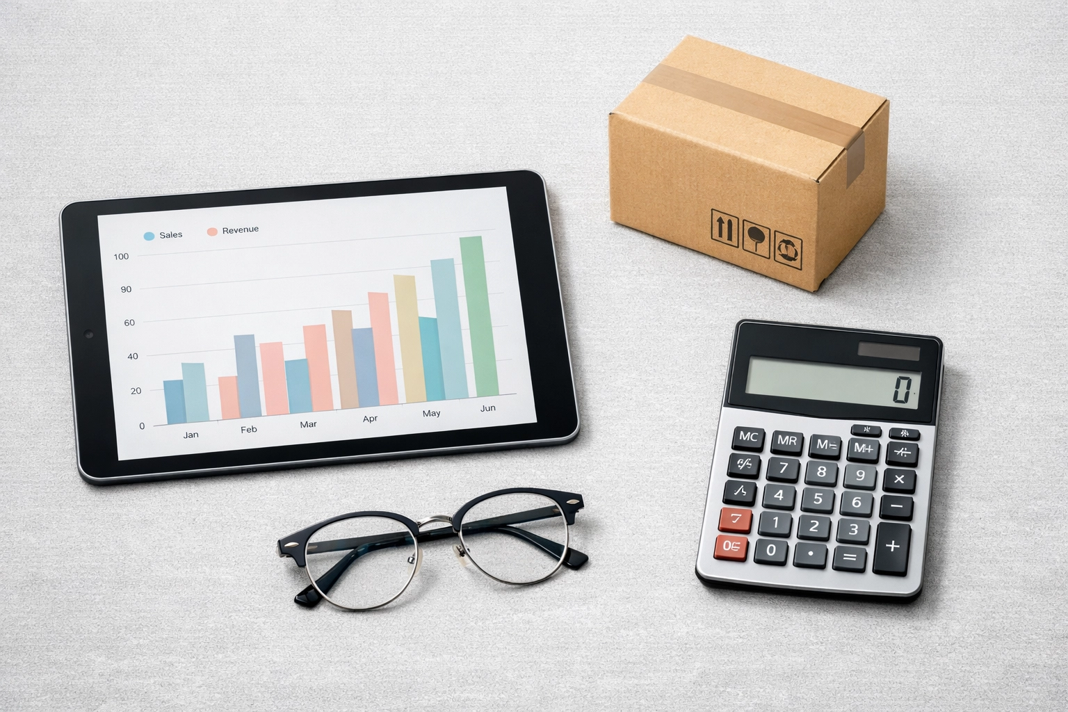 Flat-lay of accounting tools and e-commerce data showing integrated QuickBooks cash flow management.