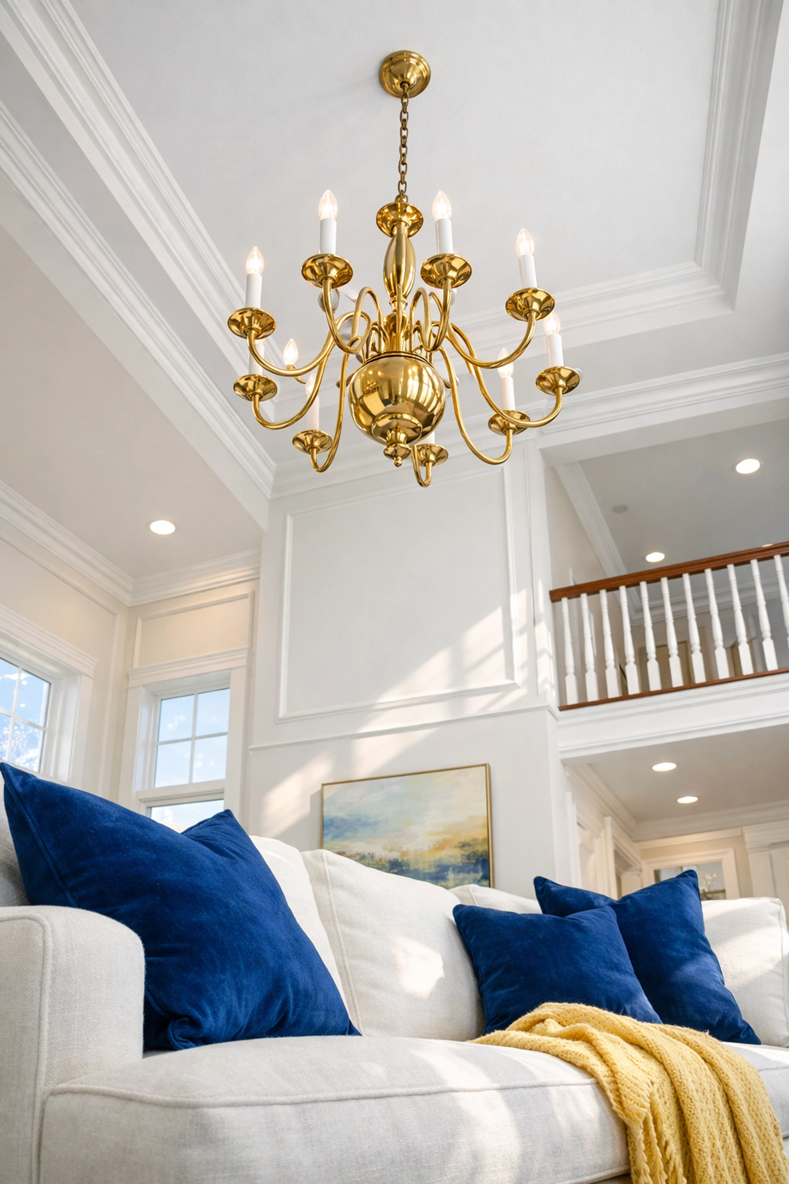 Deep cleaning services for a pristine MetroWest living room with clean high ceilings and crown molding.