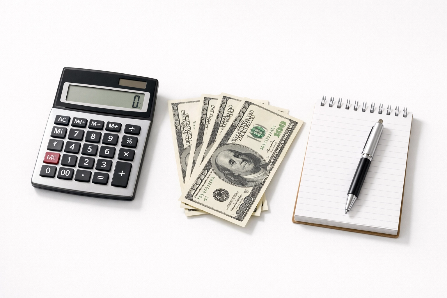 Calculator with dollar bills and notepad for 2026 tax preparation and standard deduction planning