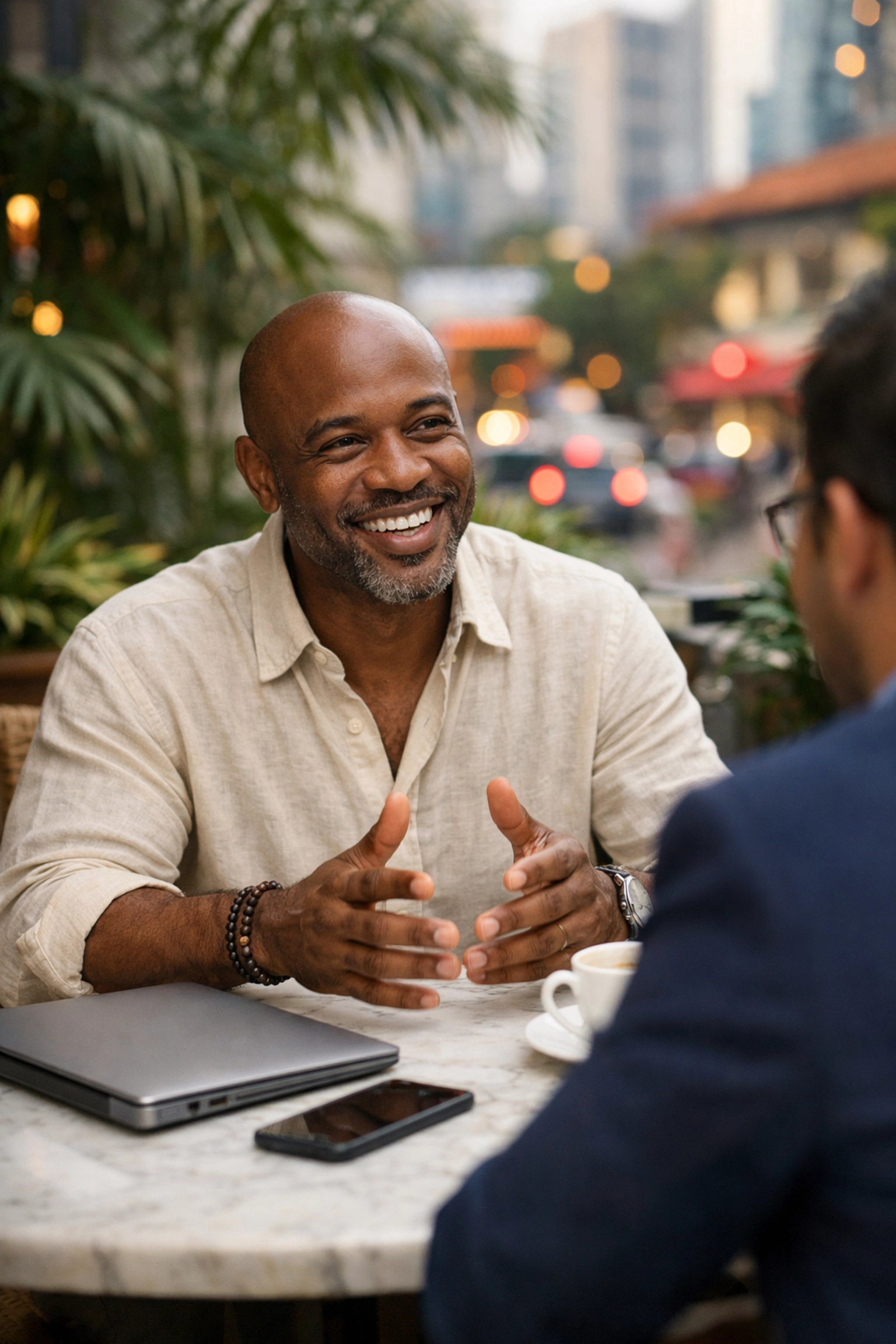 Business owner at a cafe focusing on human connection while AI systems handle content distribution.