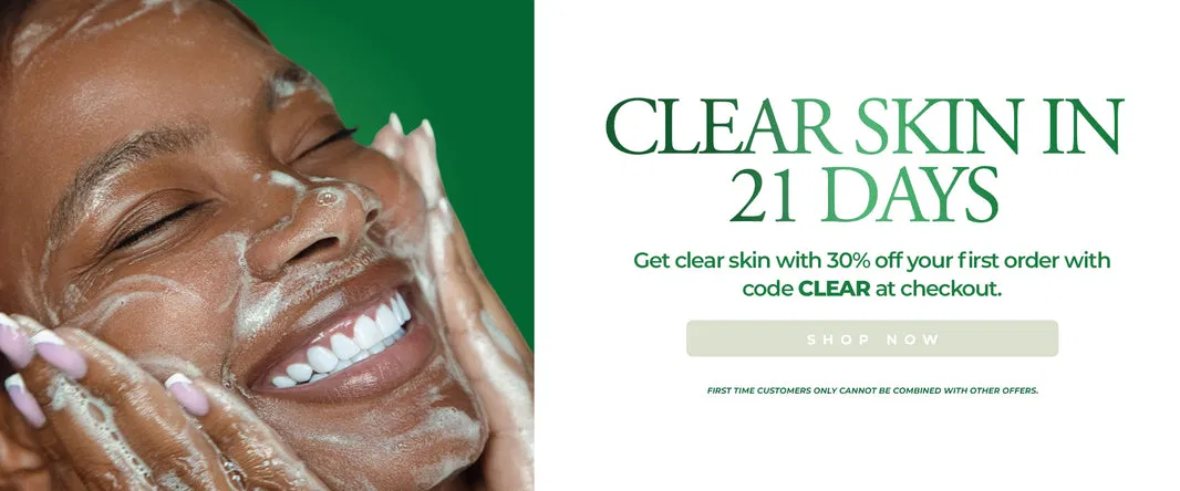 Woman cleansing her face with a foaming product on a green background