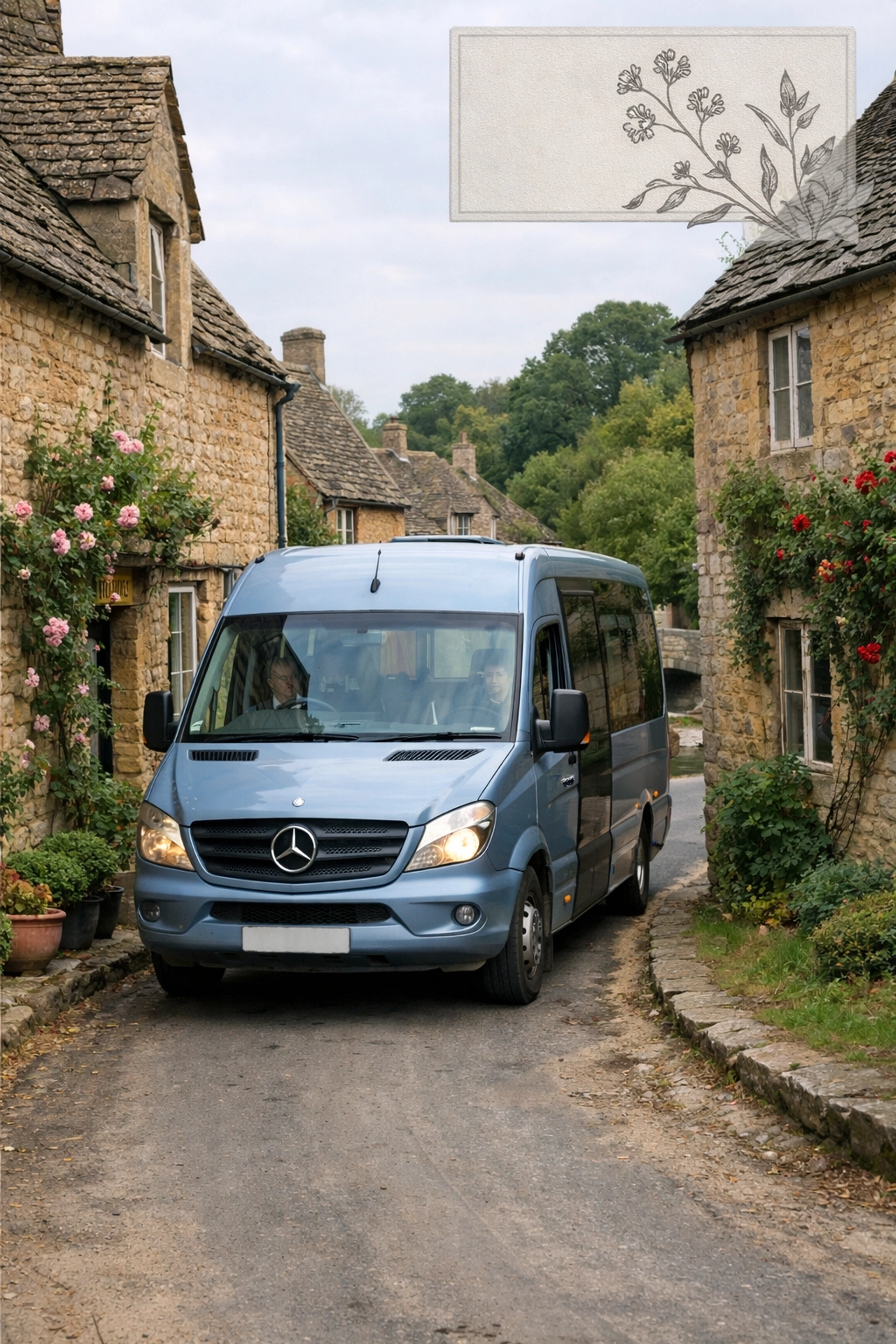 Silver Blue Mercedes minibus driving past honey-colored stone cottages on a Lower Slaughter Cotswolds tour.