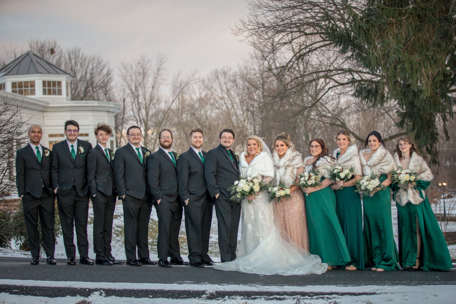 Winter wedding party in emerald green