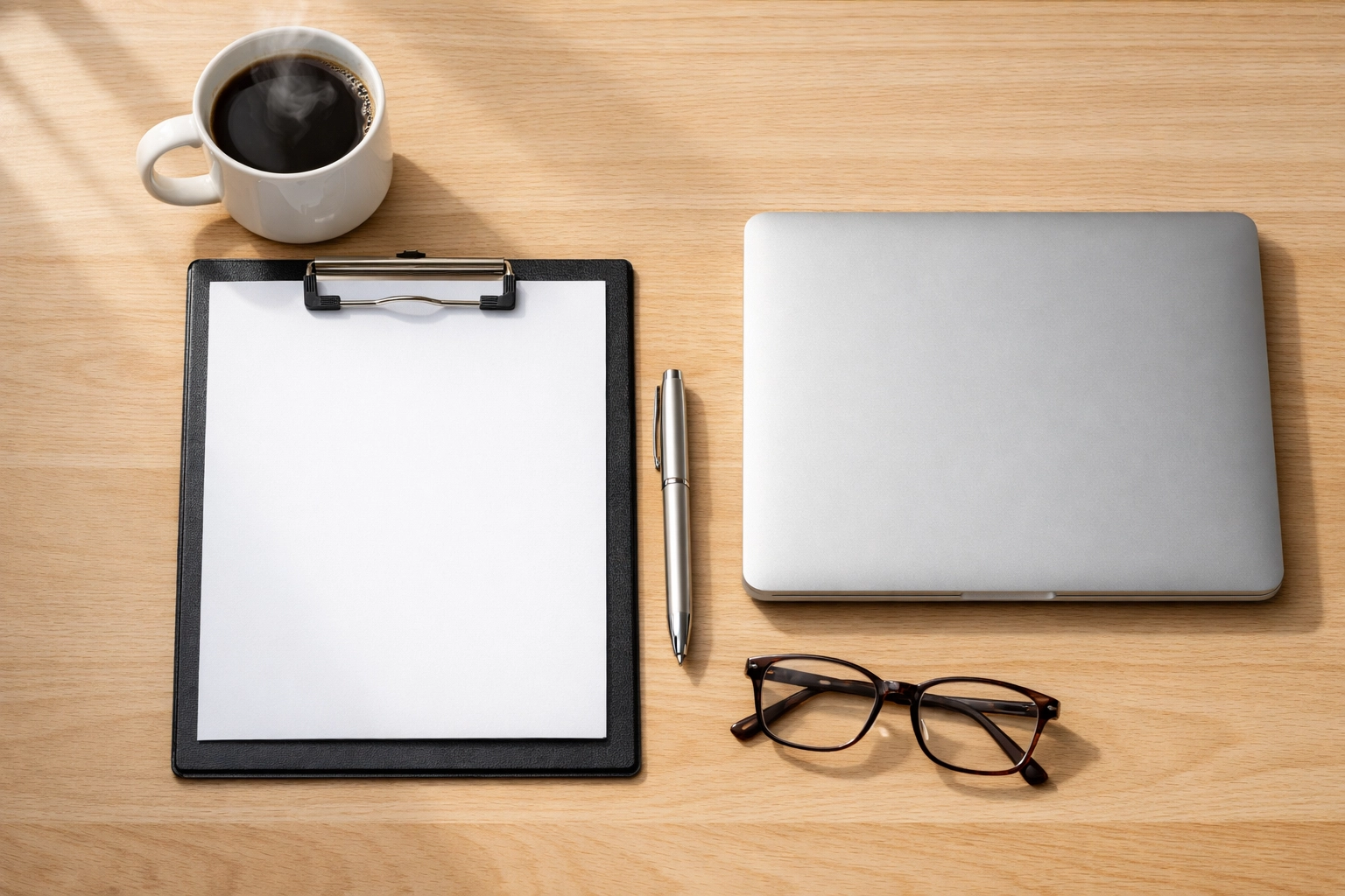 Organized rental application documents on a desk for effective tenant screening in Saskatoon.
