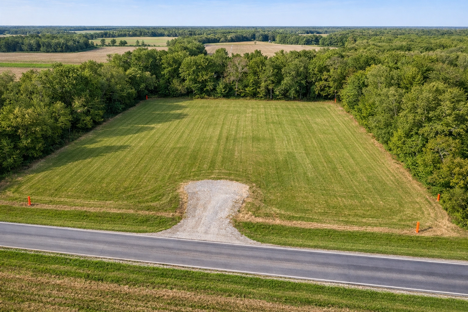 Well-maintained vacant land in Indiana with mowed grass and clear access
