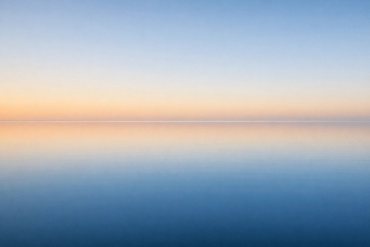 A still, peaceful lake at dawn representing spiritual stillness and the urgent need for global de-escalation.