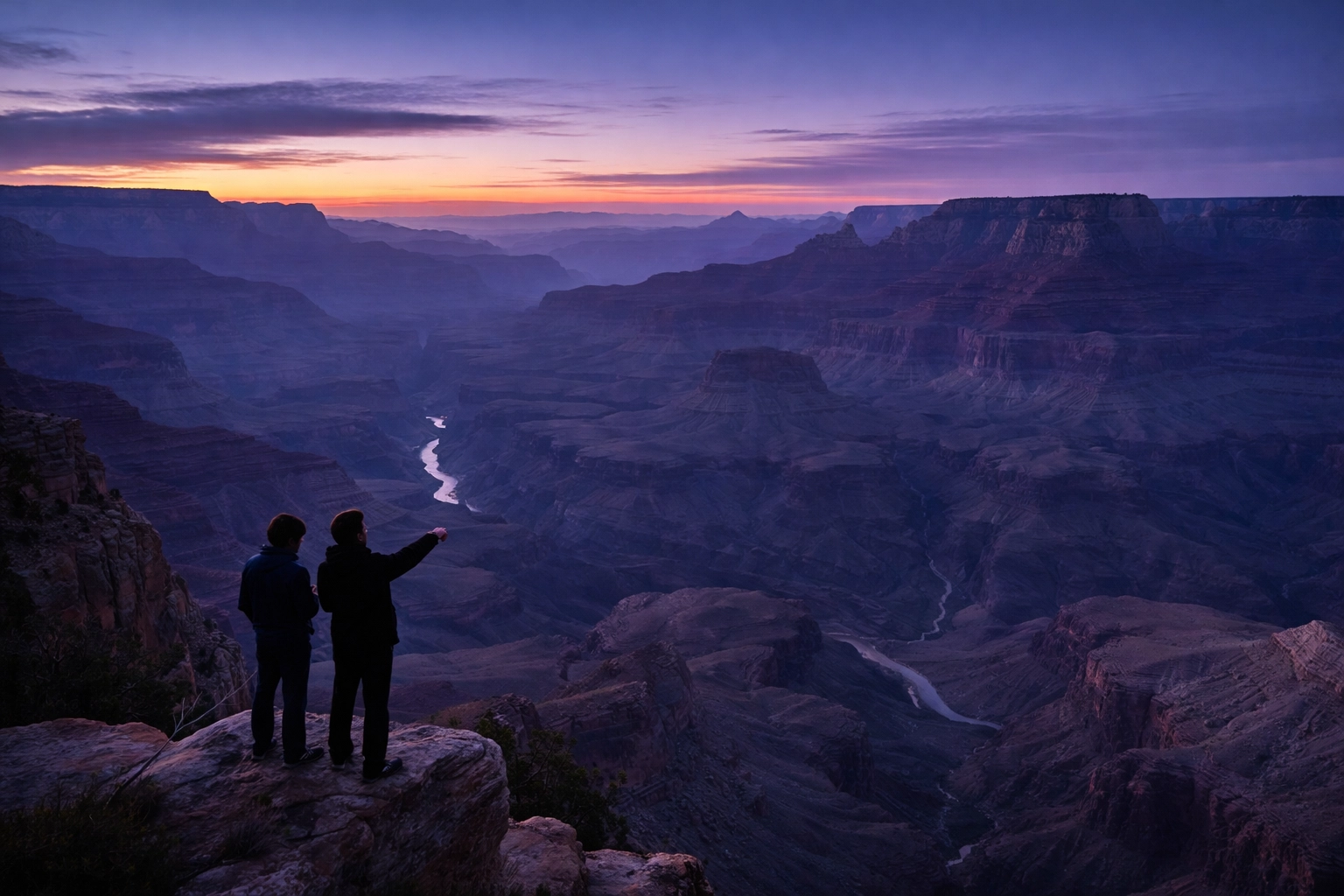 Panoramic twilight view from Lipan Point with educators at Grand Canyon rim, illustrating educational exploration and scale.
