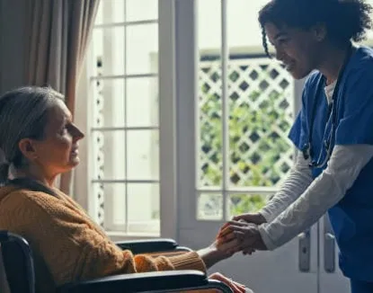 A licensed OPA Home Care nurse provides support to a senior client in a wheelchair