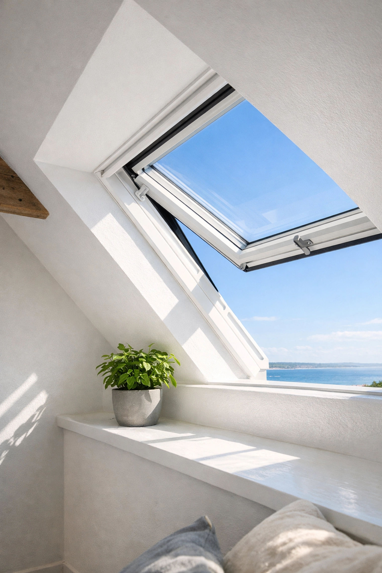 A bright skylight window in a loft conversion eaves providing natural light and essential ventilation.