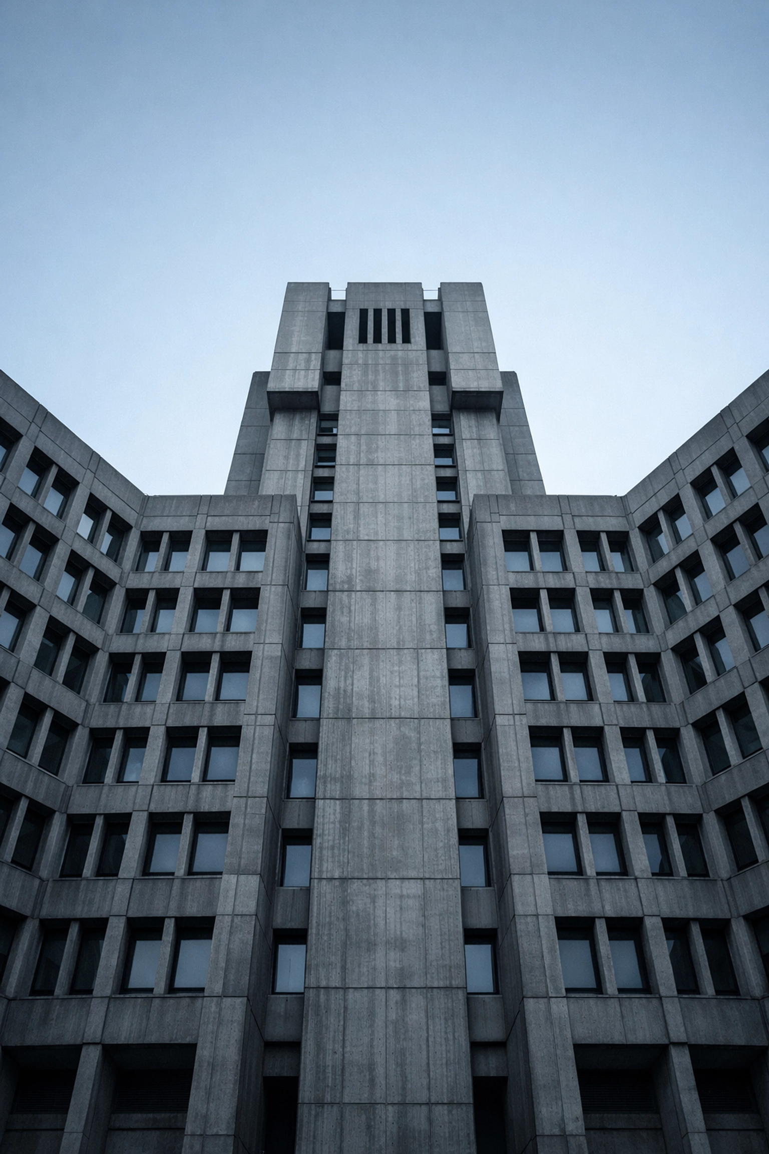 Large brutalist government building facade symbolizing centralized healthcare policy and administrative traps.