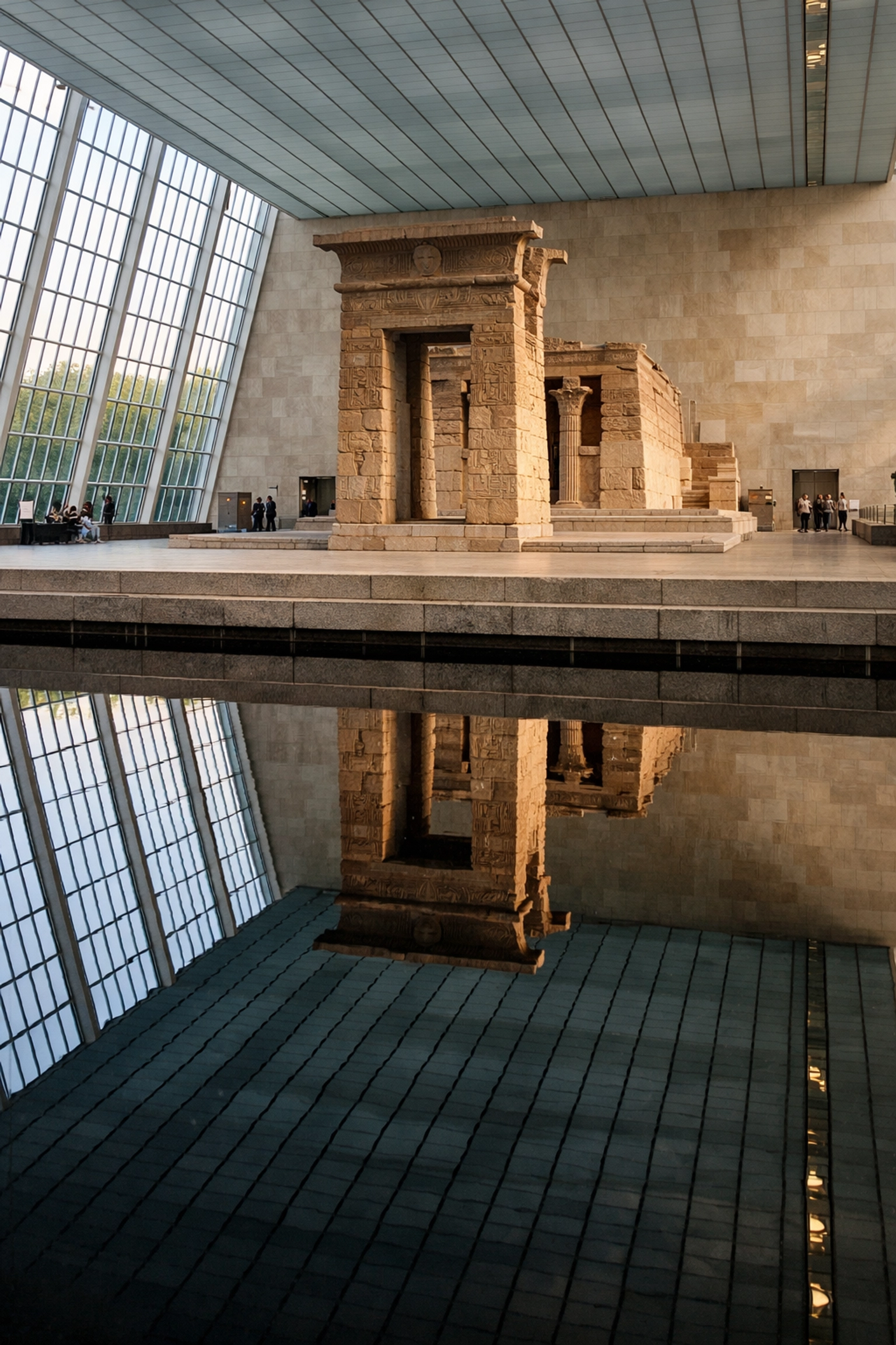 The Temple of Dendur reflected in water at the Metropolitan Museum of Art, a top NYC photo spot.