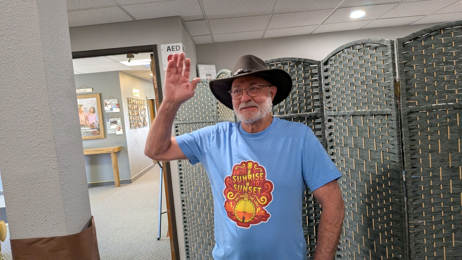 Cyril_Pluche A friendly older man in a cowboy hat