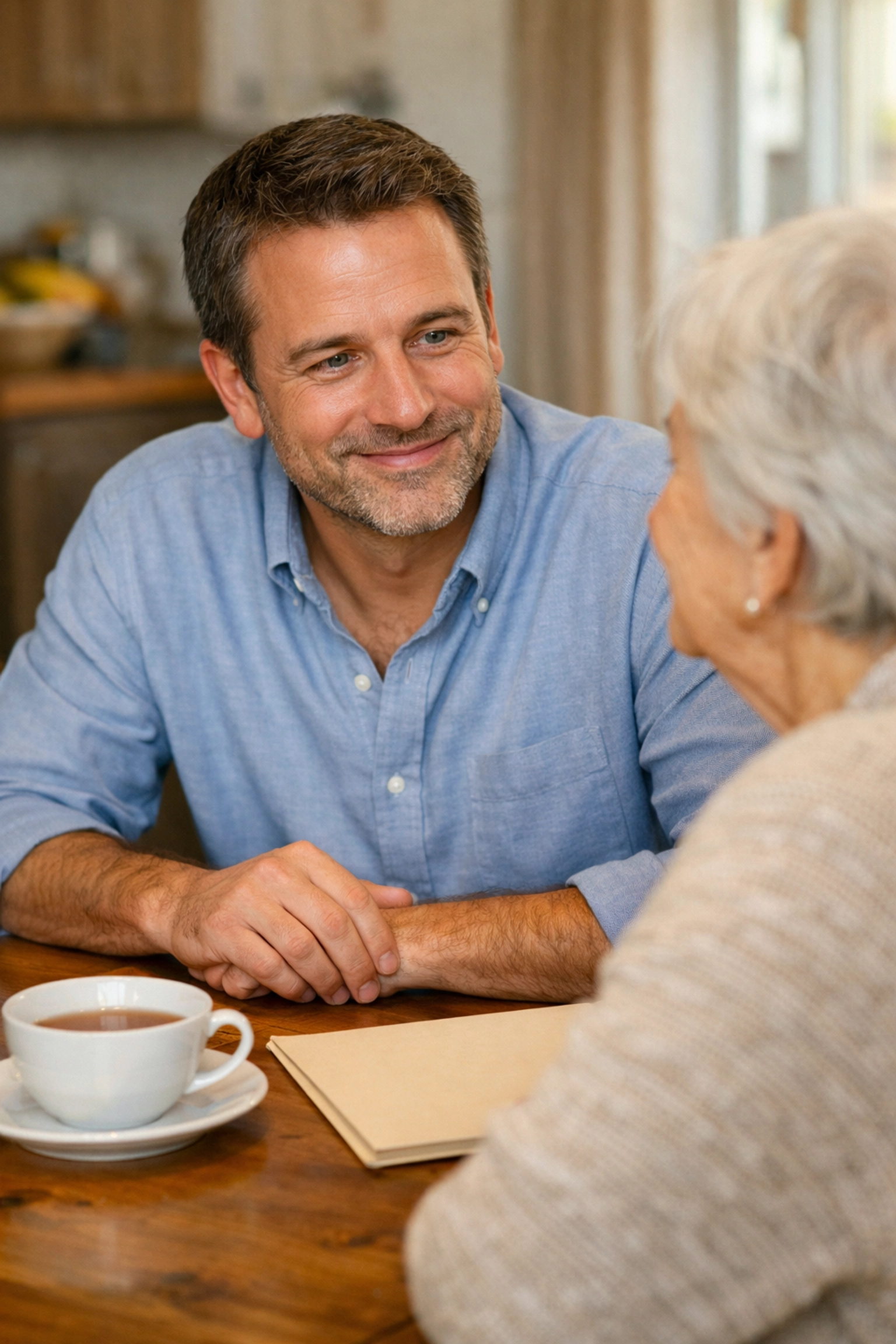 Insurance expert providing honest guidance on burial insurance to a senior woman in a comfortable home setting. Insurance expert providing honest guidance on burial insurance to a senior woman in a comfortable home setting.
