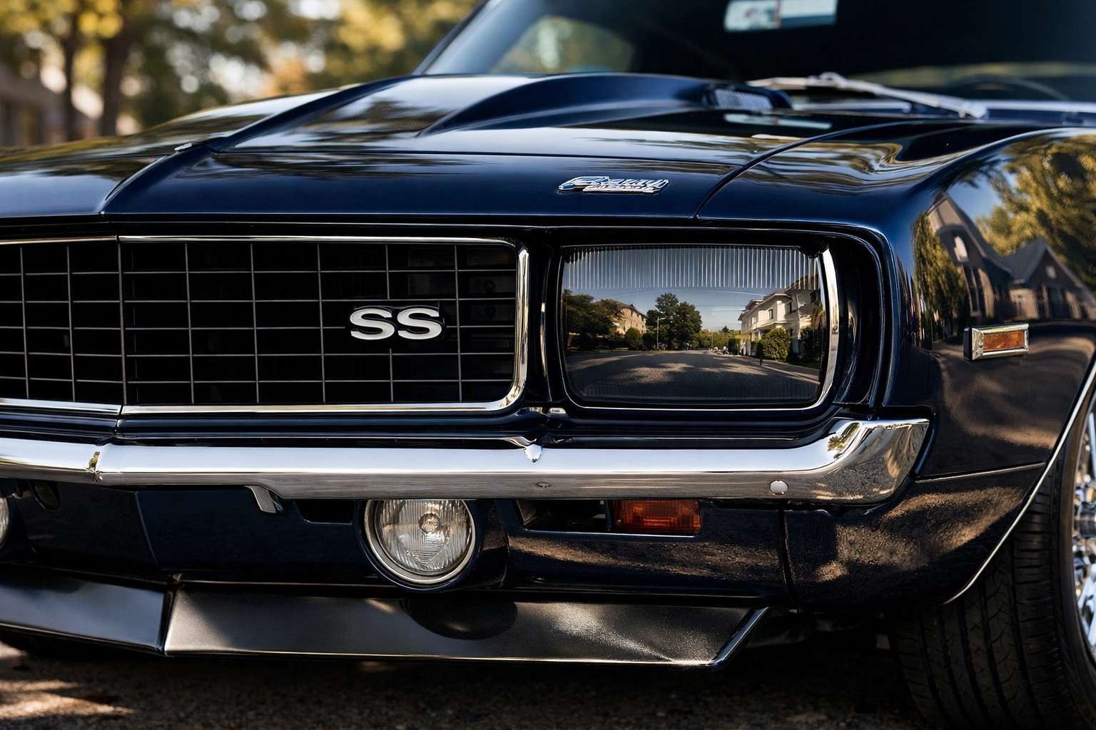 A meticulously restored 1969 Chevrolet Camaro parked on a sun-dappled Wethersfield street.