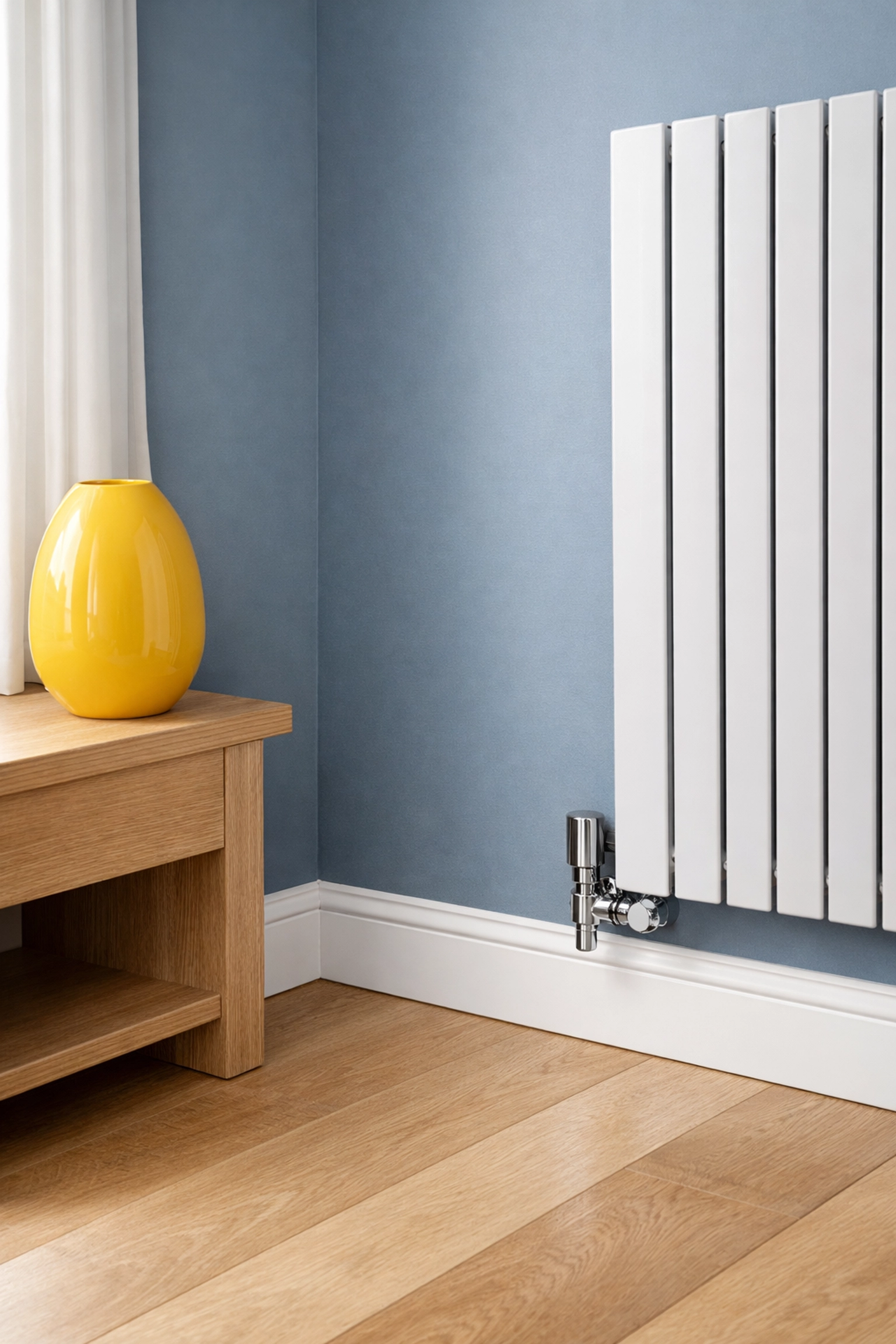 Dust-free white baseboards and clean radiator in a North Cambridge home following house cleaning Cambridge MA.