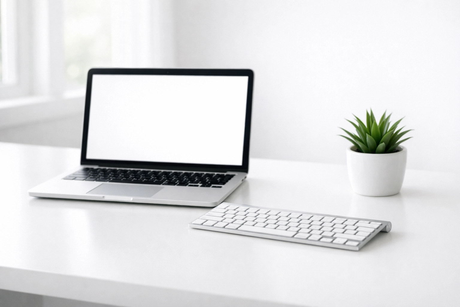 A sanitized modern office workstation showing a clean white desk and healthy workspace.