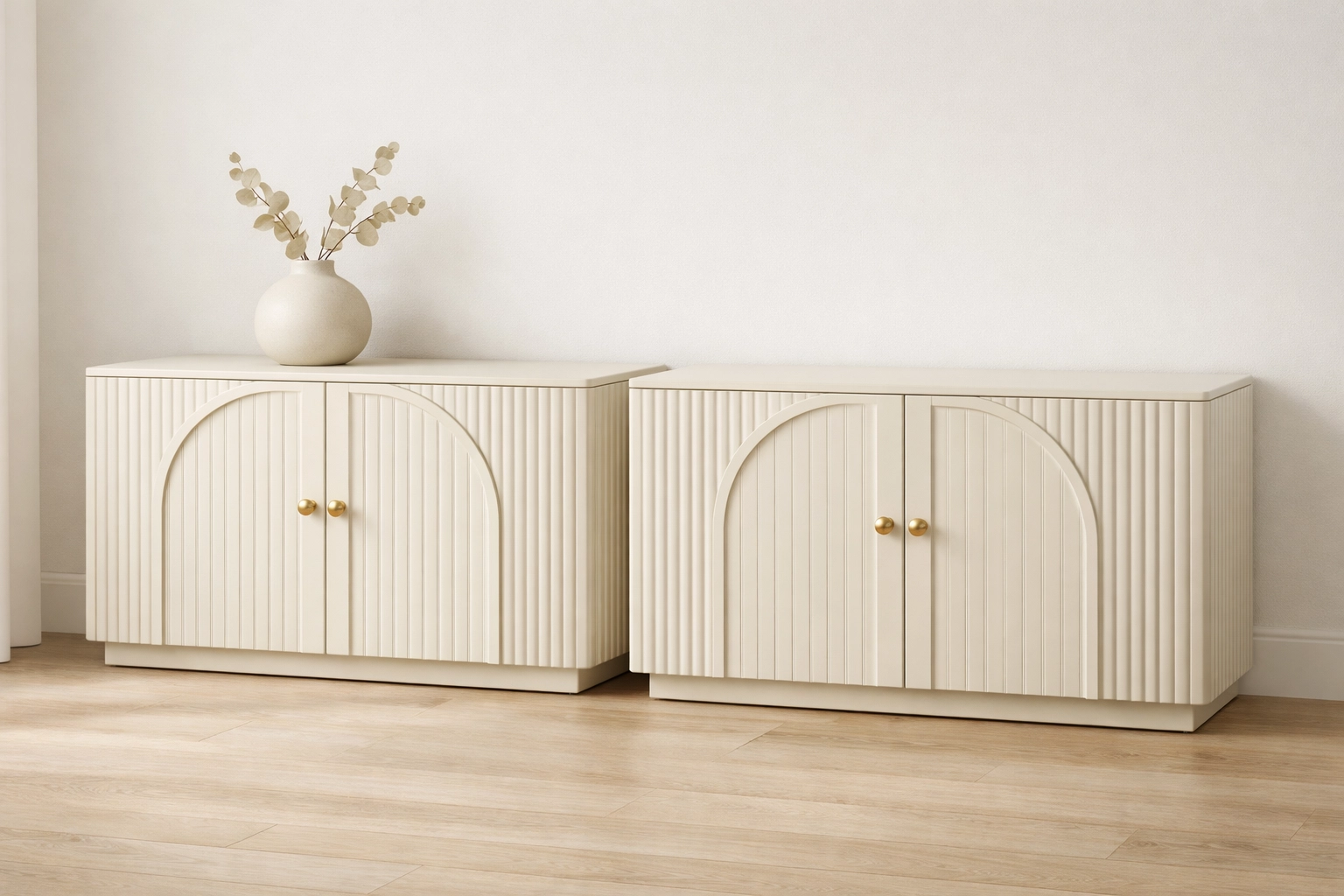 Modern cream fluted sideboards with double-arc doors and gold handles providing high-end home storage.