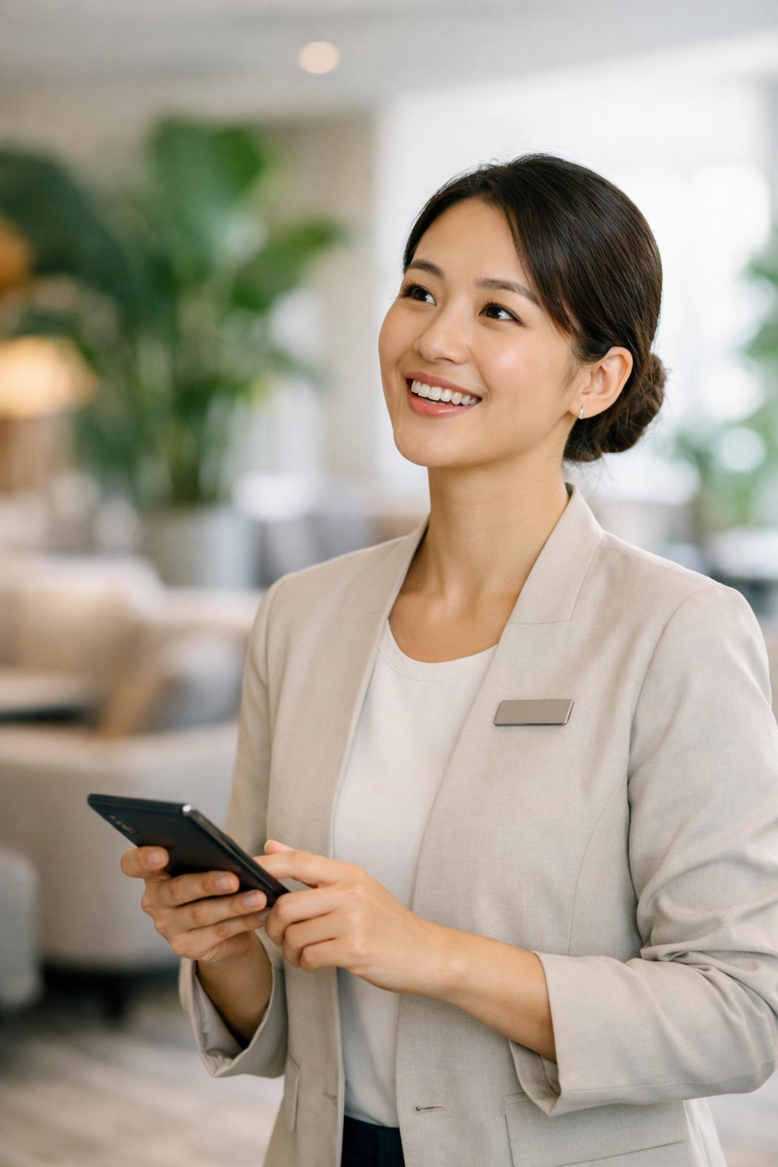 Hotel staff using mobile technology to provide instant guest recognition and personalized hospitality.