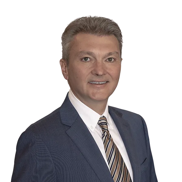 Portrait of Vitali, a well-dressed and professional real estate expert.