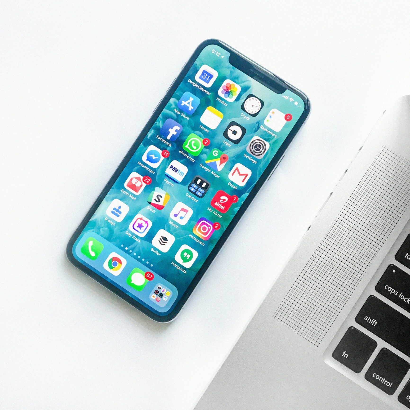 Smartphone and Laptop on Desk