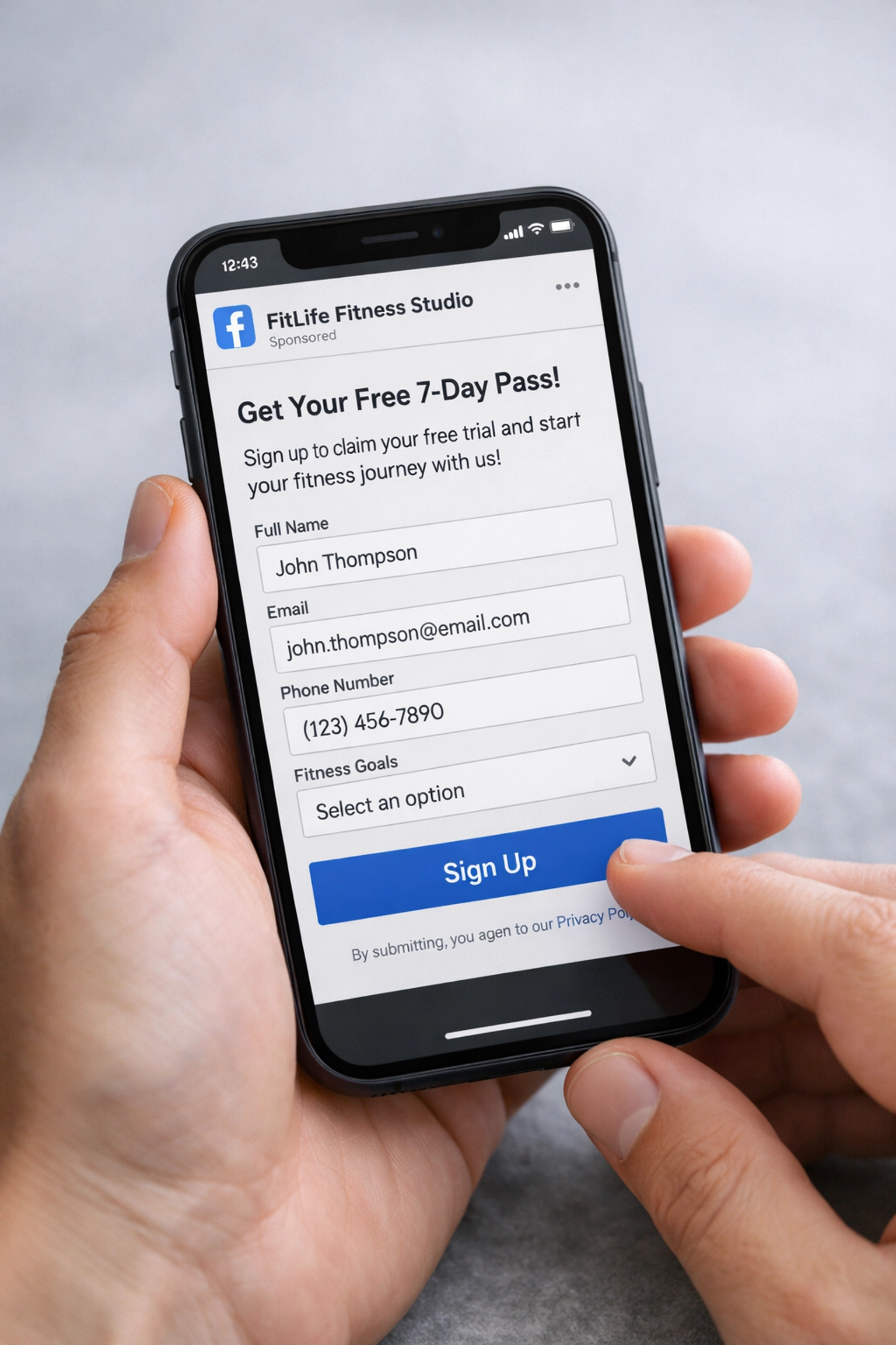 Mobile phone displaying Facebook lead generation form for fitness studio appointment booking