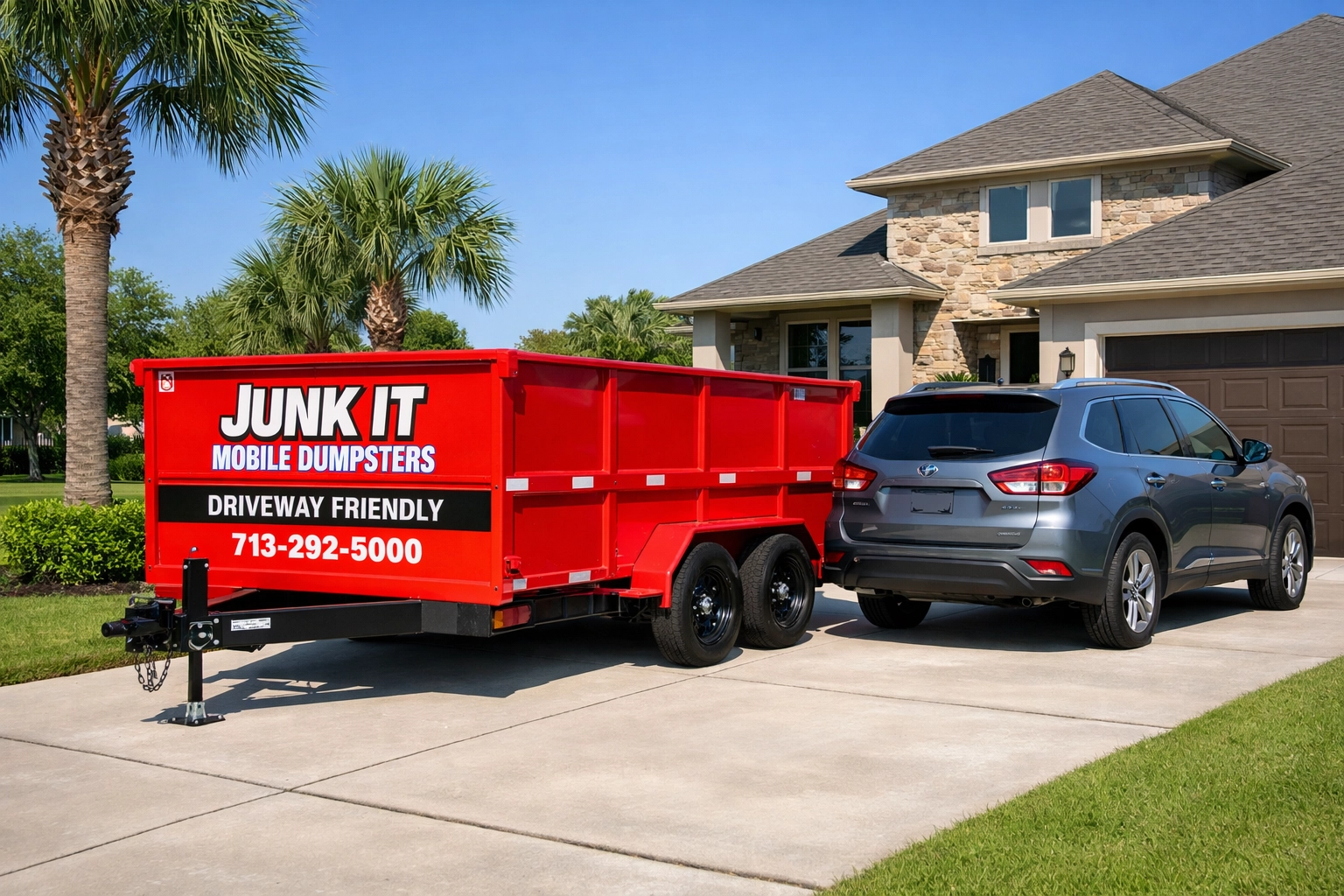 Compact red mobile dumpster trailer on rubber tires parked in a League City driveway next to an SUV.