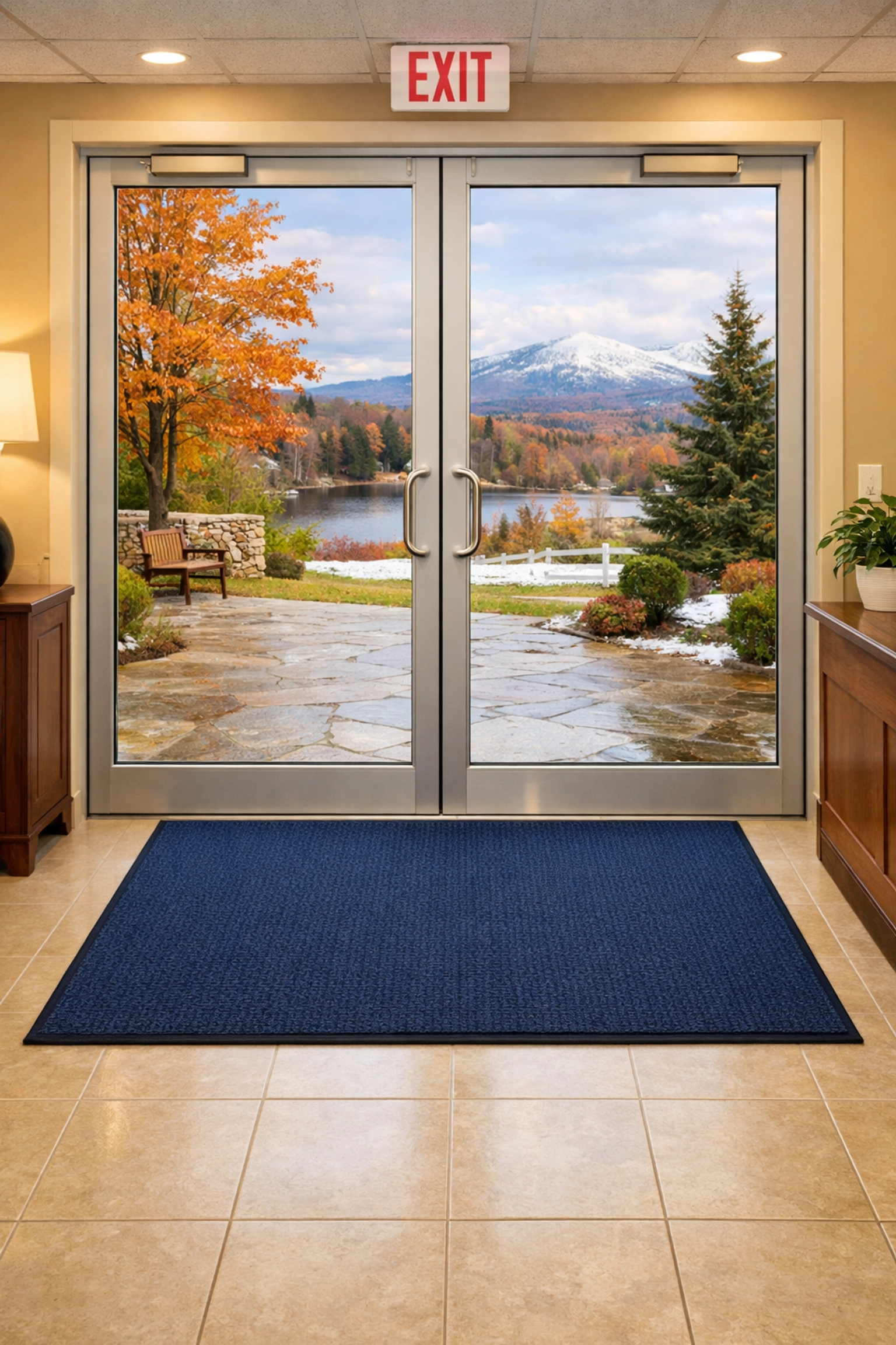 Clean office entryway in Wilbraham featuring a streak-free glass door and professional floor mats.