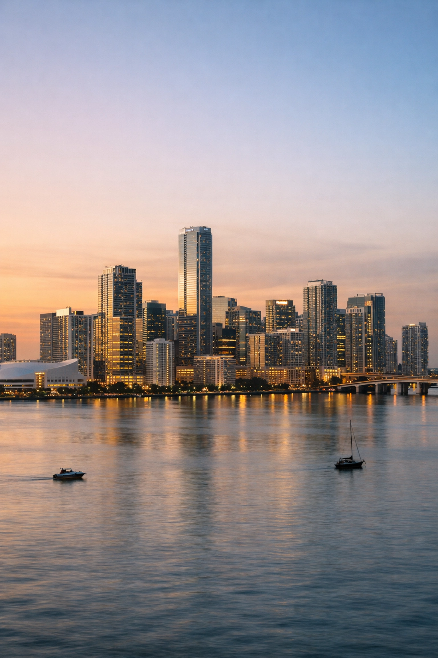Panoramic golden hour skyline views of Downtown Miami across Biscayne Bay for travel photography.